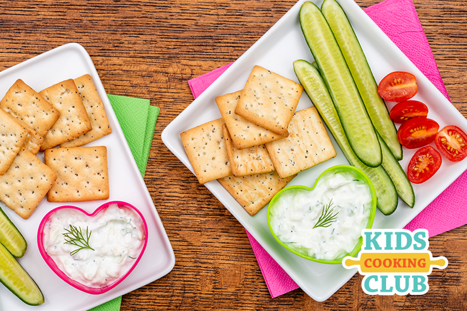 plate with crackers, cucumbers and tzatziki yogurt dip- with logo Kids Cooking Club