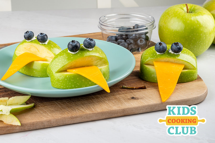 Frog apples with tongue made from cheese and eyes made from blueberries