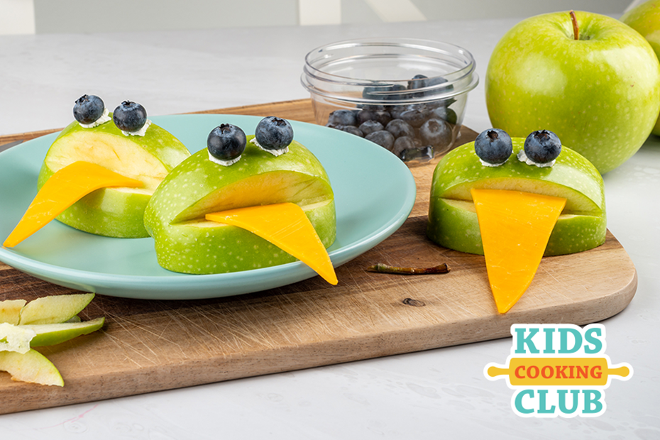 Frog apples with tongue made from cheese and eyes made from blueberries